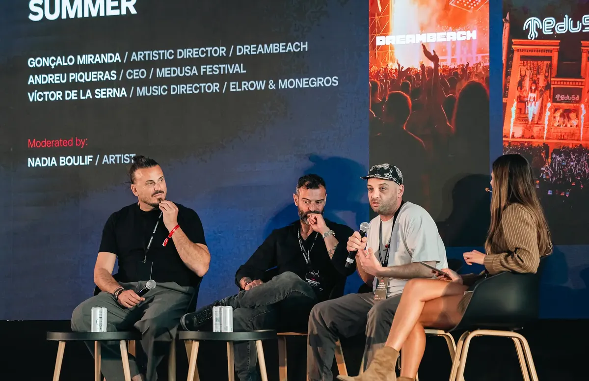 Audience at an industry panel on the main stage